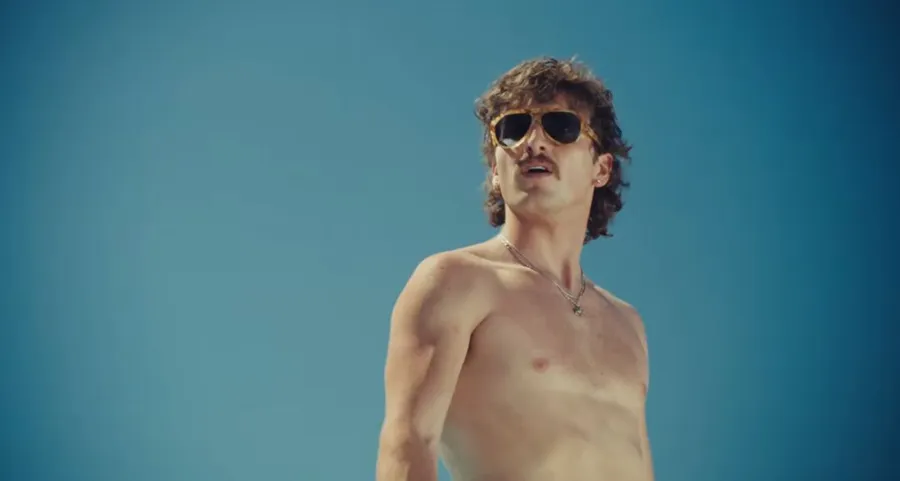 Benson Boone’s Mr Electric Blue Lyrics Meaning: Supercharged Swagger with a Glint of Satire