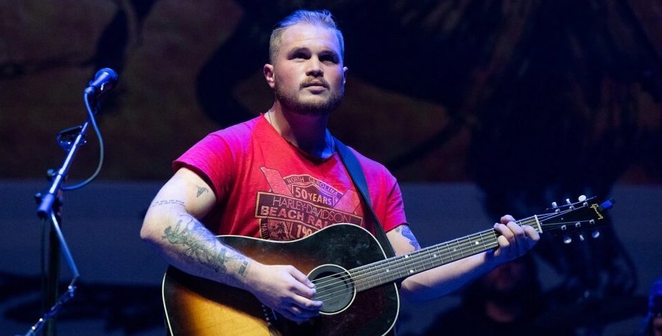 Zach Bryan’s Something in the Orange Lyrics Meaning, Versions and Enduring Impact Zach Bryan’s Something in the Orange Lyrics Meaning, Versions and Enduring Impact