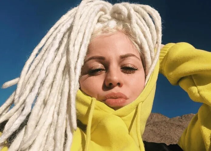 Òlah Bliss in a yellow hoodie