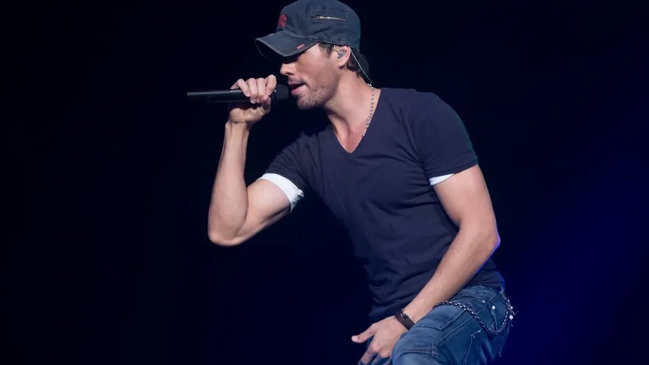 Enrique performing on stage