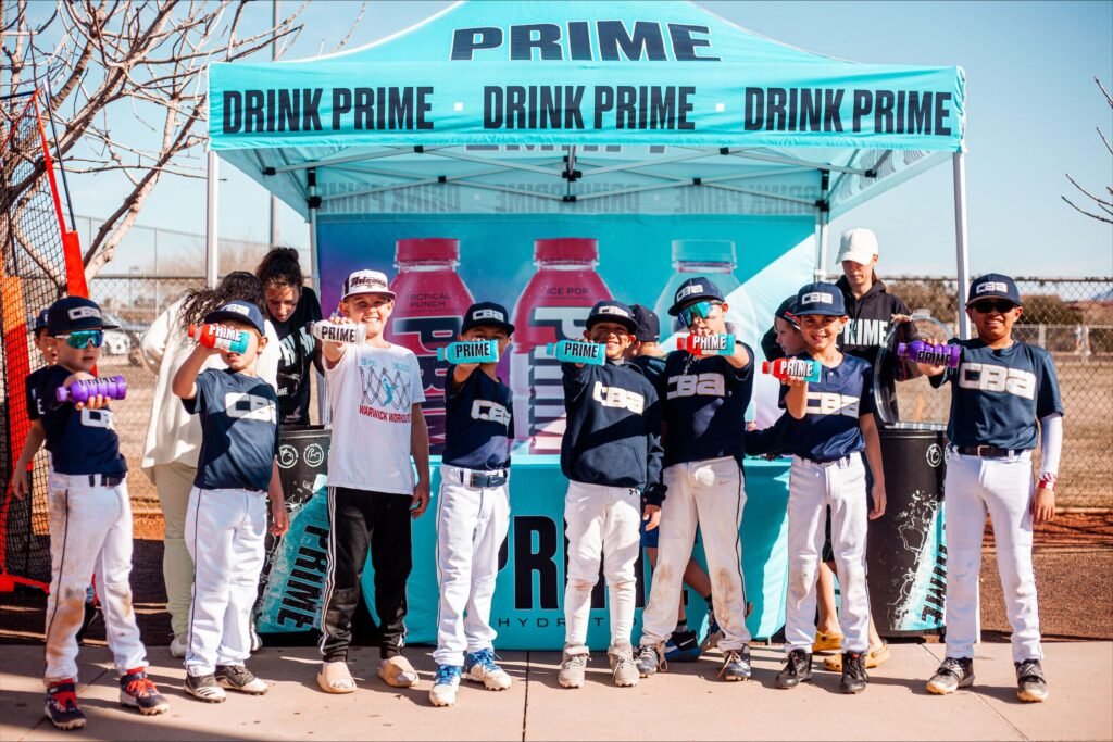 Picture of kids holding Prime drinks