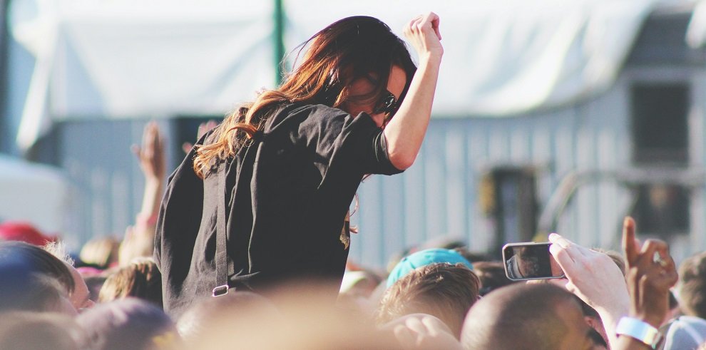 Woman at a festival wearing sunglasses