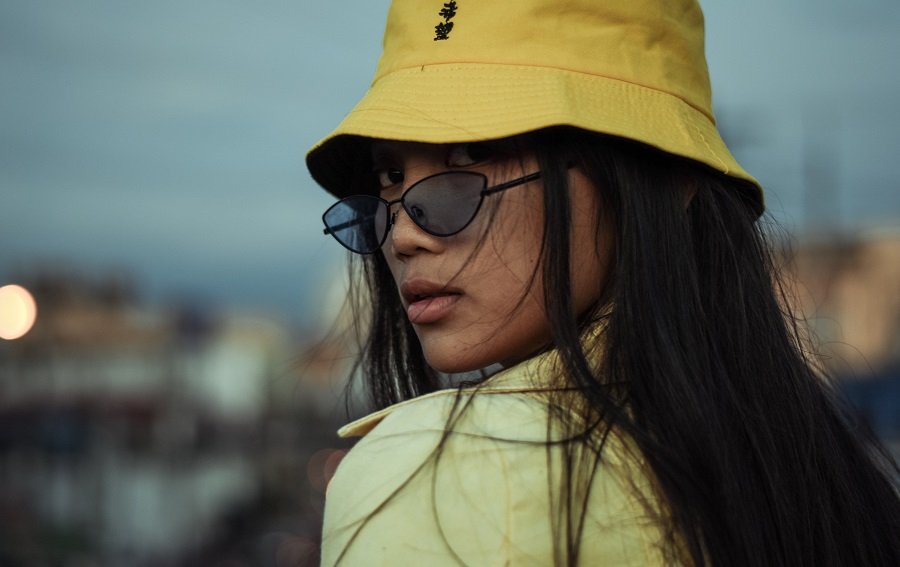 Woman wearing a hat at a festival