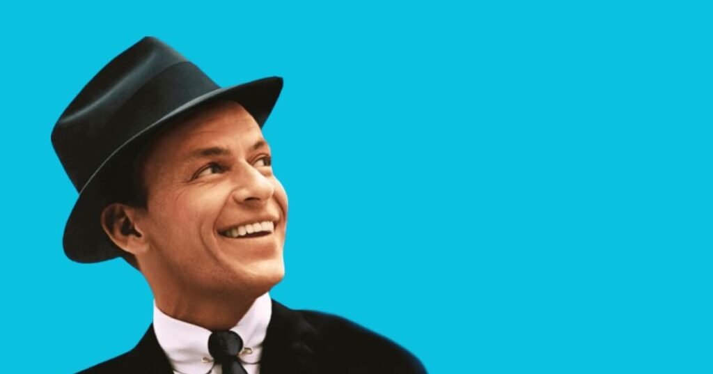 Frank Sinatra smiling in promotional image from the 1960s, often associated with Fly Me to the Moon