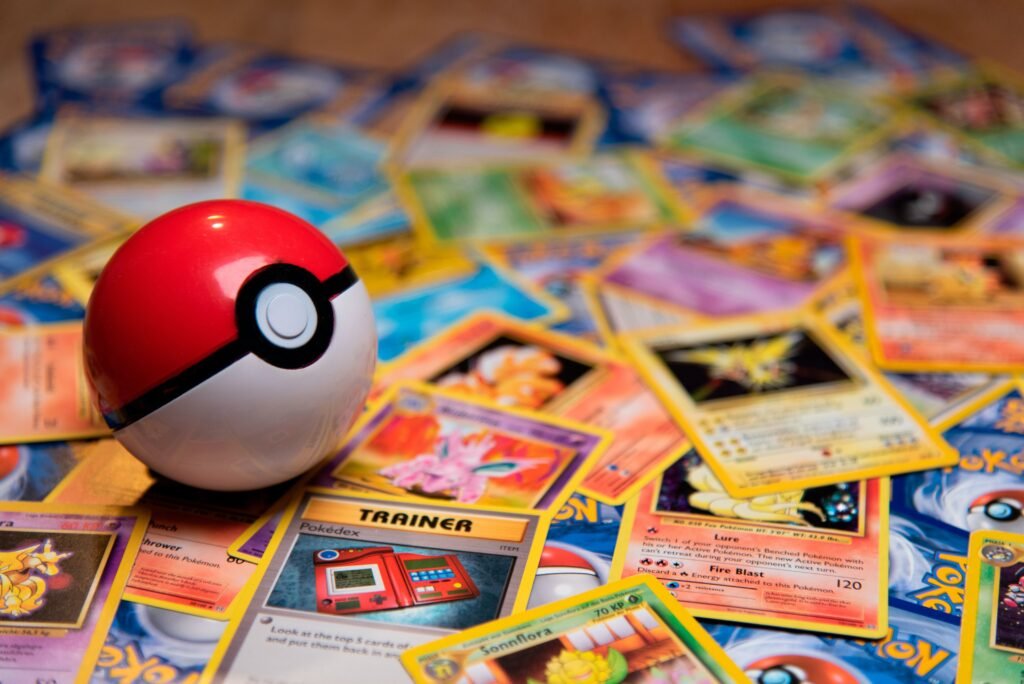 Classic Pokeball Toy on a bunch of Pokemon Cards.