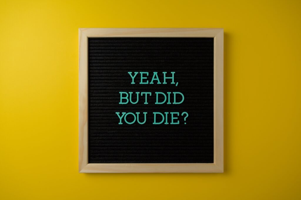 Close-Up Shot of Text on a Wooden Frame
