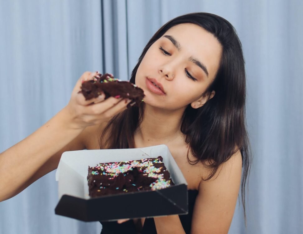 Woman Eating Chocolate Cake
