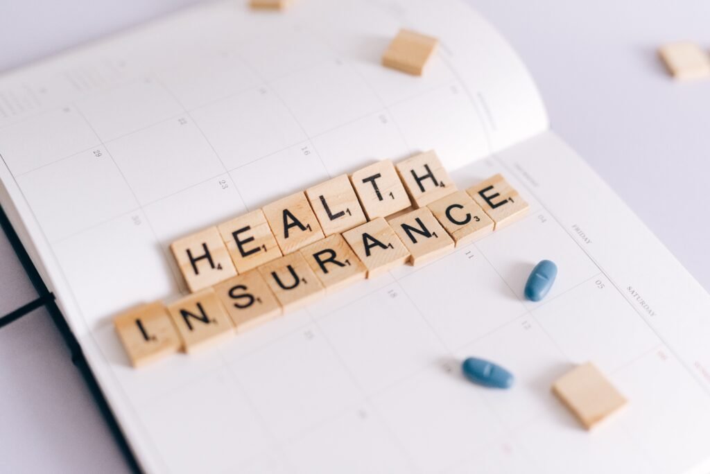 Health Insurance spelled with Scrabble pieces
