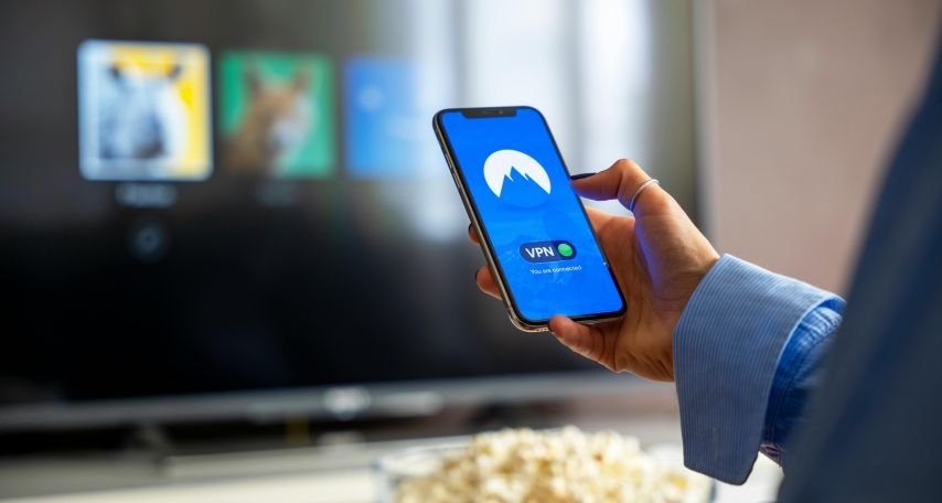 Person Holding Phone With VPN Display