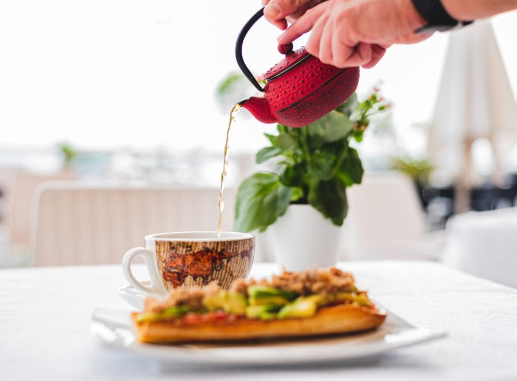 Pouring tea into a mug