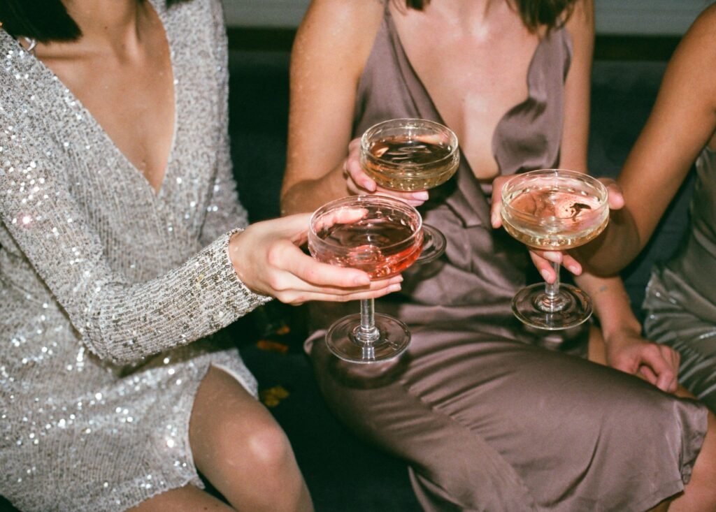 Women holding wine glasses