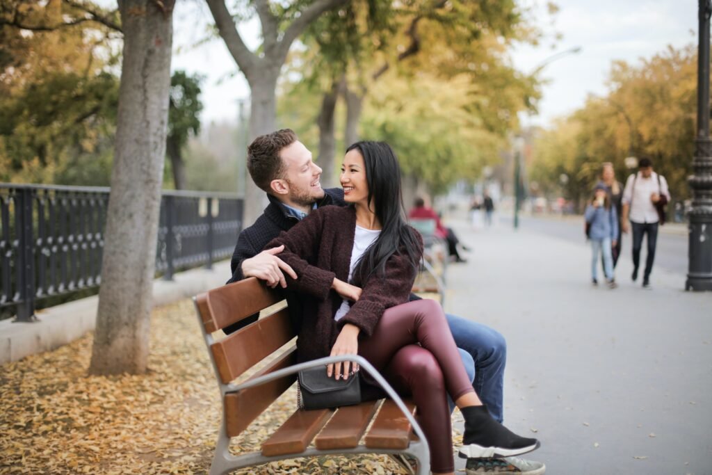 Couple sitting on a pack bench