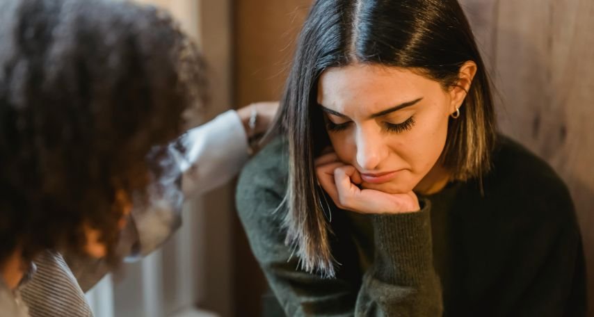Woman comforting a frustrated female friend