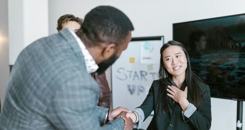 A Man Shaking a Woman's Hand
