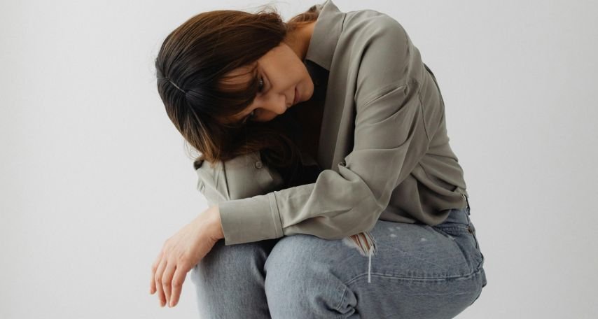 Woman in Gray Long Sleeves Looking Down
