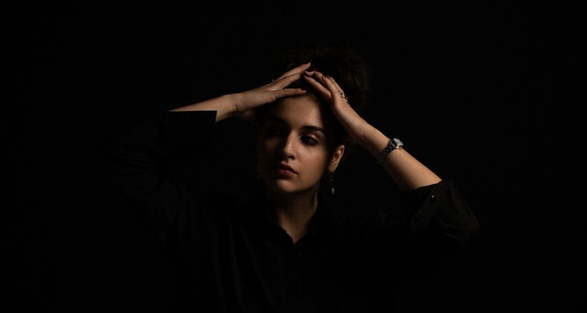 Woman with Her Hands on Her Head