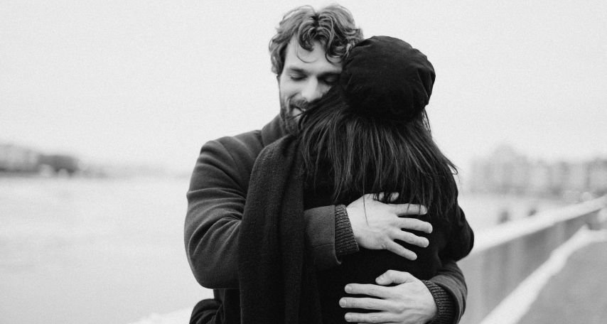 Man and Woman Hugging on Bay View
