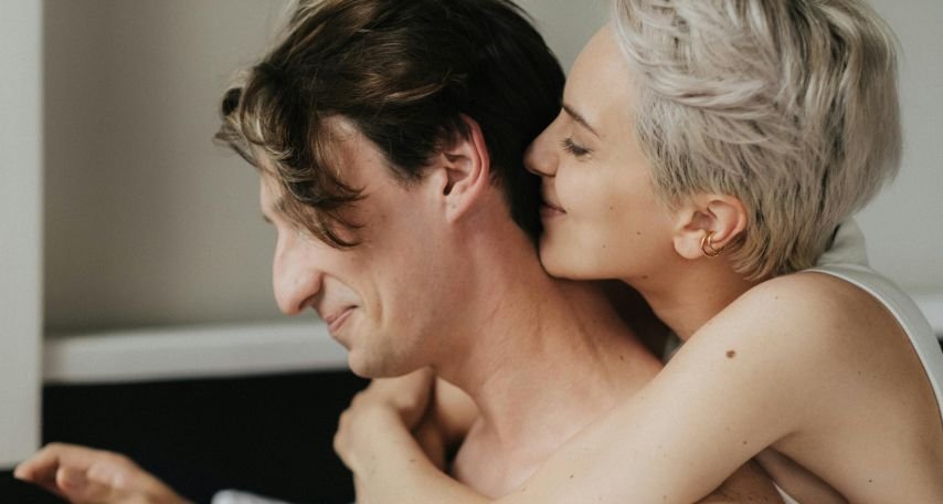 Woman Kissing Man's Nape
