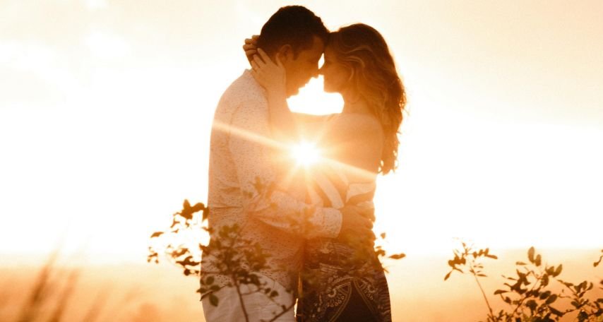 Couple Standing Beside Plants during Golden Hour