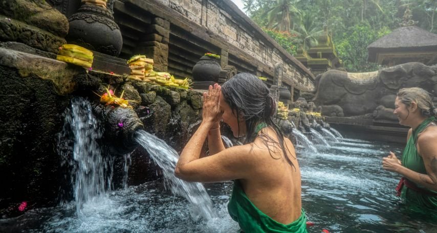 Woman Standing in Front of Flowing Water
