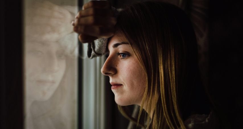 Woman Leaning on Glass Window