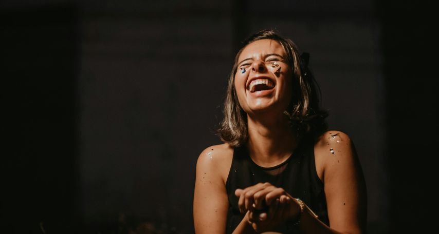 Woman Laughing Wearing Black Top