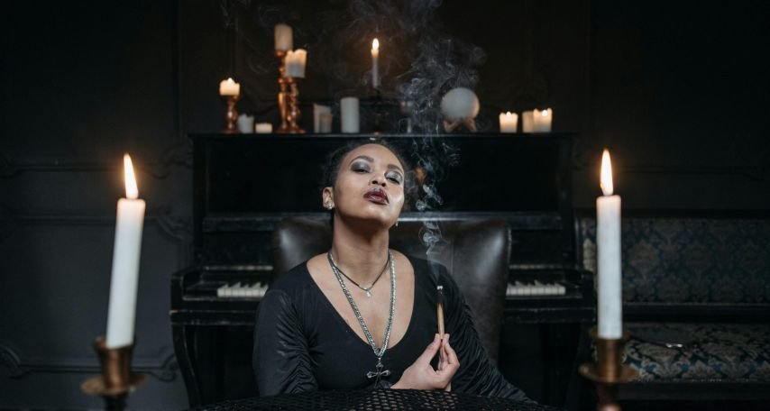 A Woman Holding a Burning Palo Santo
