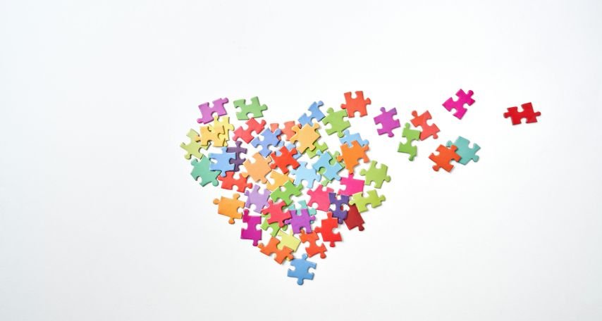 Broken Heart Shaped Puzzle Pieces in White Background