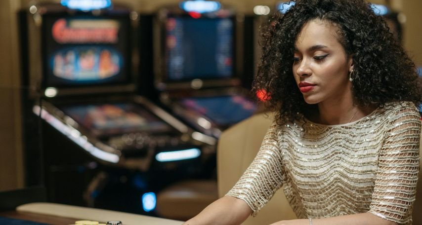 A Woman Betting a Stack of Chips on a Gaming Table