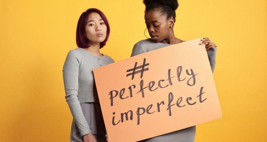 Women in Beige Long Sleeves Posing in Yellow Background
