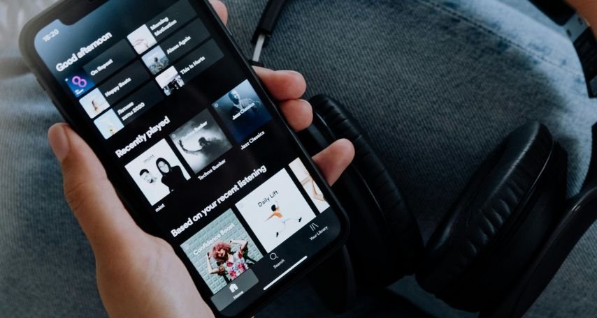 Person Using Spotify on an Iphone

