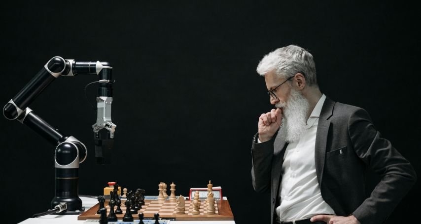 Elderly Man Thinking while playing an AI opponent in Chess