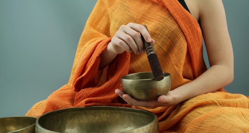 A Person Holding a Tibetan Singing Bowl