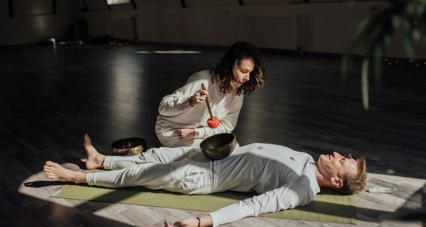Singing Bowl on a Man Lying on Yoga Mat