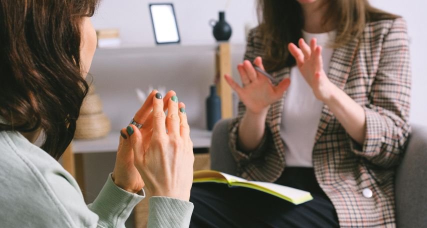 Two women discussing
