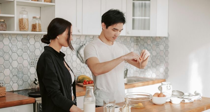 A Couple Preparing Food in the Kitchen