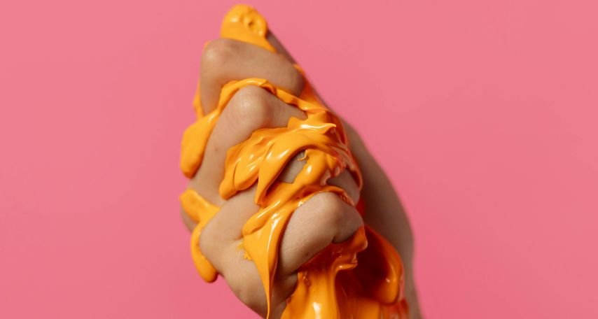Person Squeezing Orange Slime