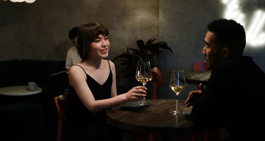 Man in Black Long Sleeve Shirt Sitting on Chair