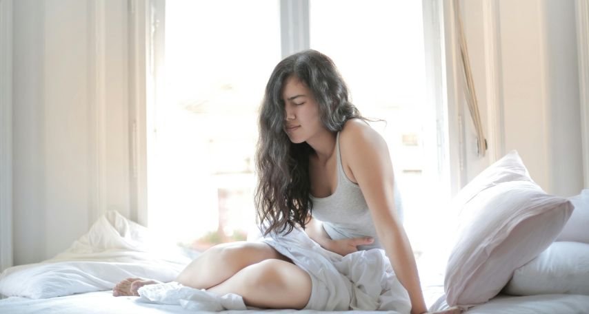 Woman Suffering from a Stomach Pain. Photo by Andrea Piacquadio