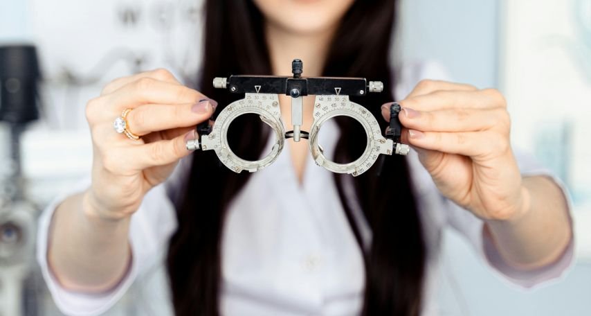 A Woman Holding Trial Lens Frame