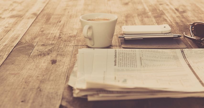 Newspaper and a cup of coffee