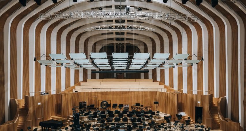 The interior of a large auditorium with a large orchestra