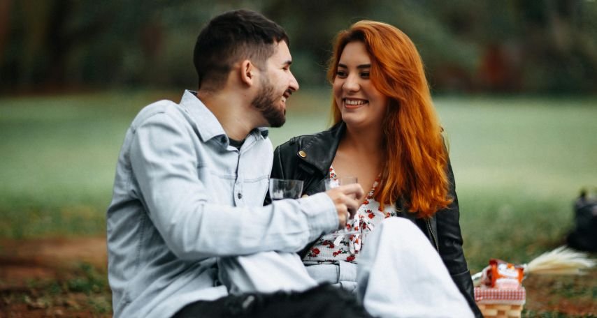 Man and Woman Drinking Wine at a Picnic
