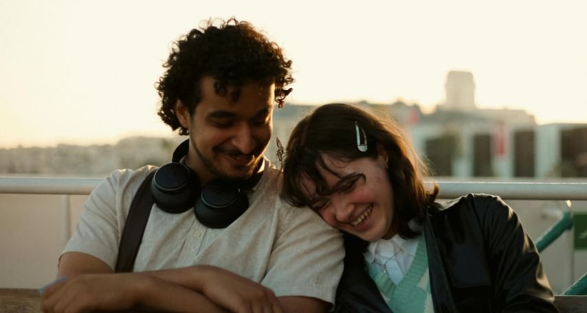 Laughing Woman Leaning on Mans Shoulder
