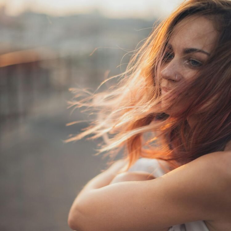 Young woman sitting on rooftop