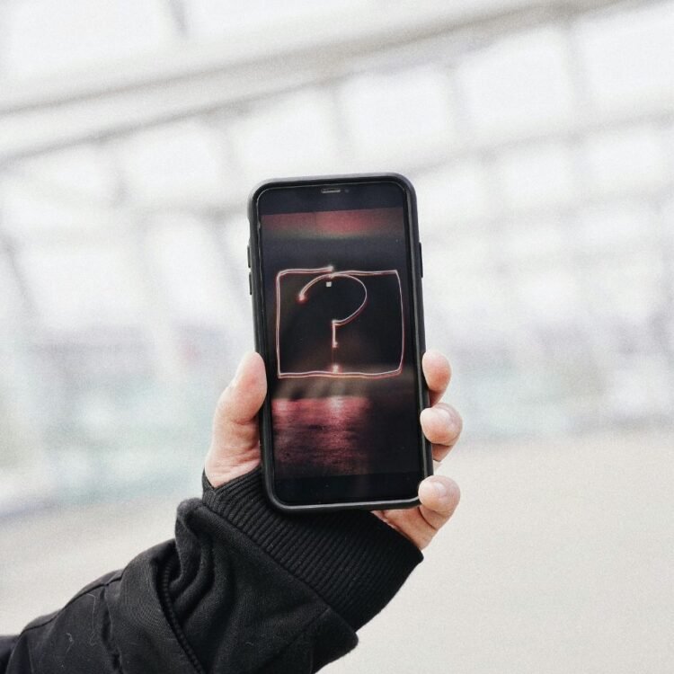 Person Holding Black Iphone
