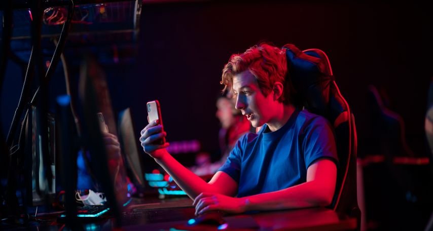 Gamer looking at a Phone