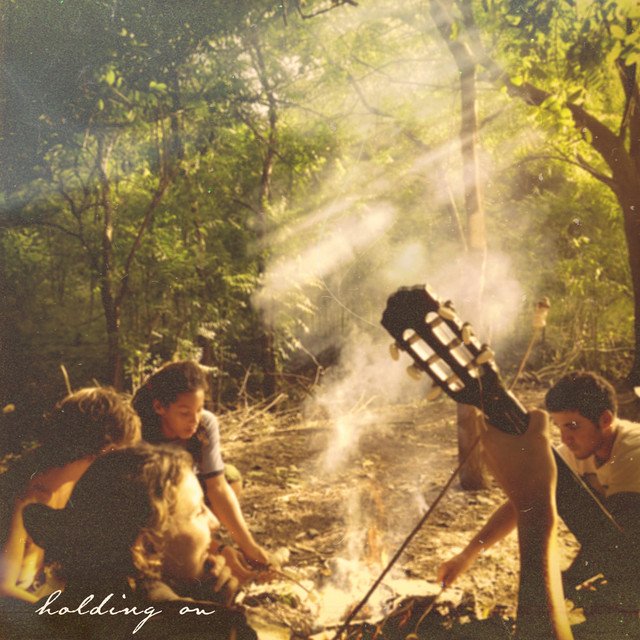 Joshu holding on song artwork