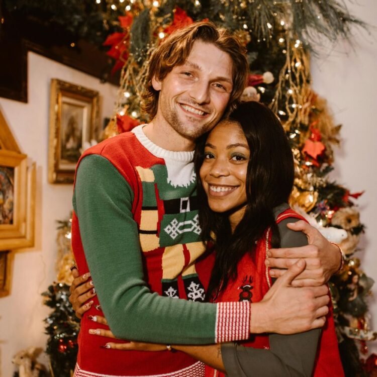 Couple Standing Beside a Christmas Tree Embracing Each Other