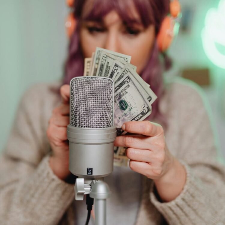 A Woman Holding US Dollar Bills.